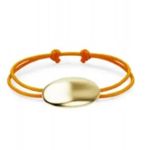 An early bracelet render: a smooth gold oval threaded on a doubled orange cord.