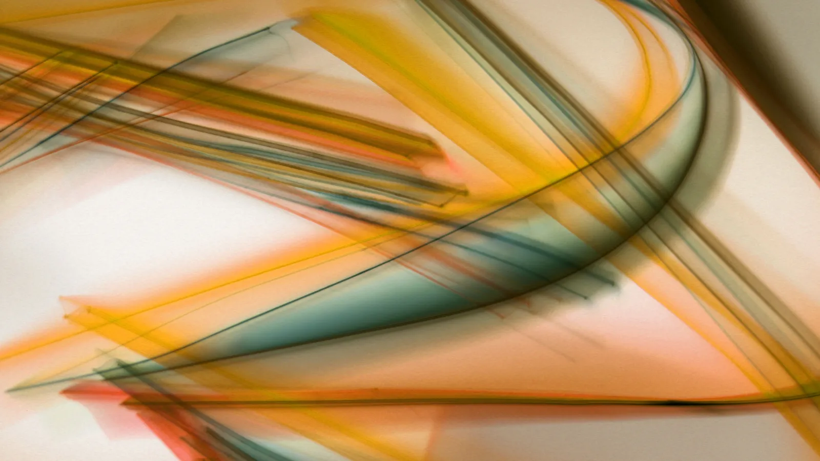 An abstract long-exposure photograph of translucent orange, yellow and teal streaks sweeping in a long curve across a pale cream background.